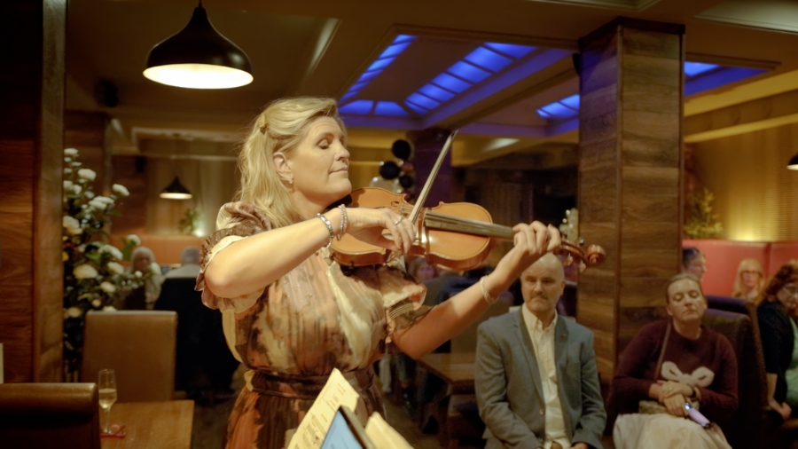 The Salvage Symphony – Rebekah Durston plays the violin at a meeting of Clonmel and Ballymena musicians. Photography by Bearfoot Productions. The Salvage Symphony - Rebekah Durston plays the violin at a meeting of Clonmel and Ballymena musicians. Photography by Bearfoot Productions.